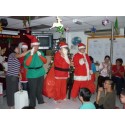 Santa Claus and Elf greet all children during Christmas Party